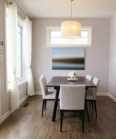 A bright, contemporary dining room with minimalist decor and modern furnishings.